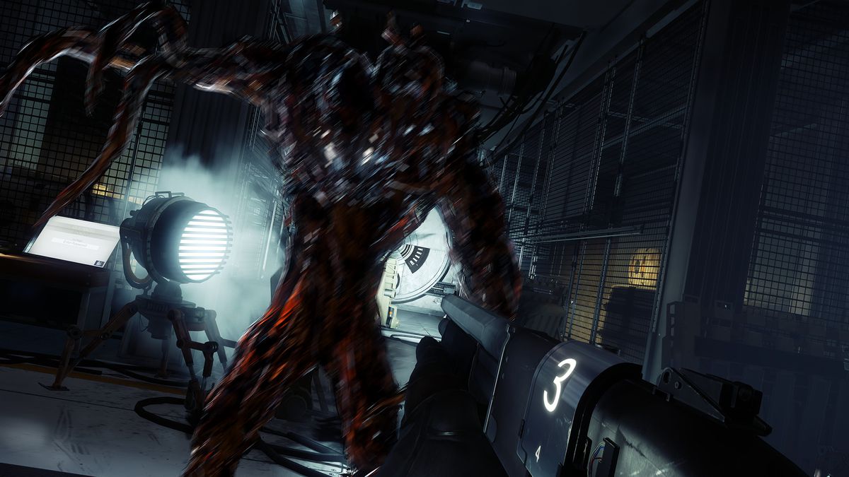 A Typhon-ravaged crew member of the Talos I threatens the protagonist.  The creature is a space suit full of black, inky material that extends into tentacles.  The Typhon is located in an industrial hall.