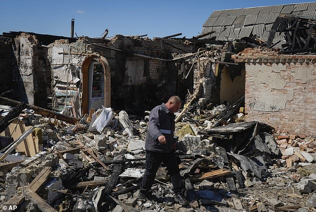 The US government advised citizens to leave Russia after the invasion of Ukraine.  Pictured: A gas worker inspects a destroyed private house after a Russian missile attack in the Kiev region, Ukraine, May 8, 2024