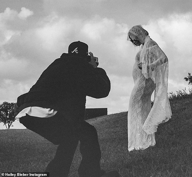 She debuted her bump in a custom Saint Laurent lace wedding dress by Anthony Vaccarello, paired with a flowing veil, during a surprise vow renewal in Hawaii.