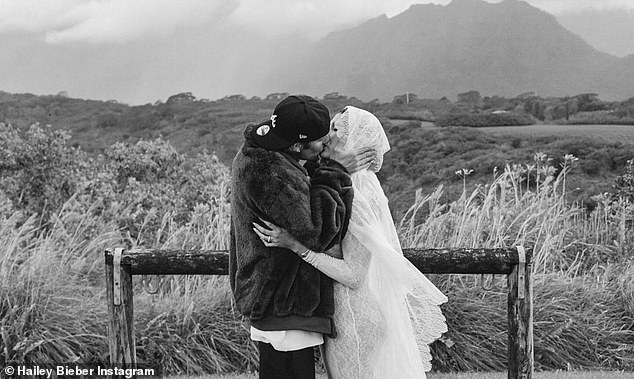 The star and the Baby hitmaker shared a sweet kiss as they celebrated their news during their outdoor ceremony - with Hailey wearing a new diamond ring