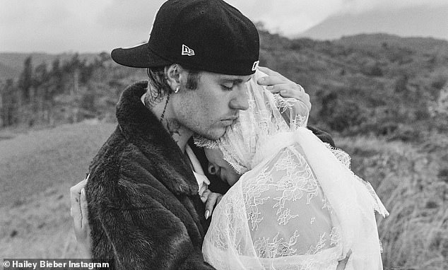 Justin - who was dressed casually in a backwards cap, bomber jacket and jeans - was seen filming his bride as she cradled her bump - as the video was set to a new song by the Grammy winner