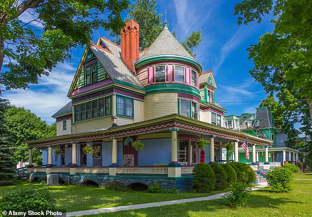 The city is surrounded by rolling hills and rivers and has a population of 26,700.  Pictured: The Christmas House store in a Queen Anne Victorian home in Elmira