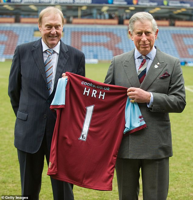 The King (pictured in 2010 with former Burnley boss Barry Kilby) is a Clarets fan and will be hoping Spurs don't condemn the side to relegation