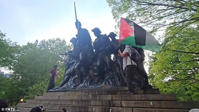 The vandals also covered the statue with anti-Israel stickers and a protester was seen burning the American flag