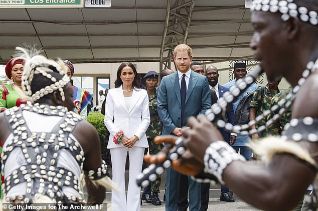 Harry and Meghan were given a rock star welcome upon arrival in Nigeria as crowds gathered to greet them and the military rolled out the red carpet