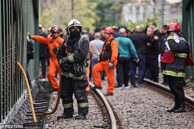 The fire brigade ordered passengers to remain on the train due to a possible oil leak before being evacuated