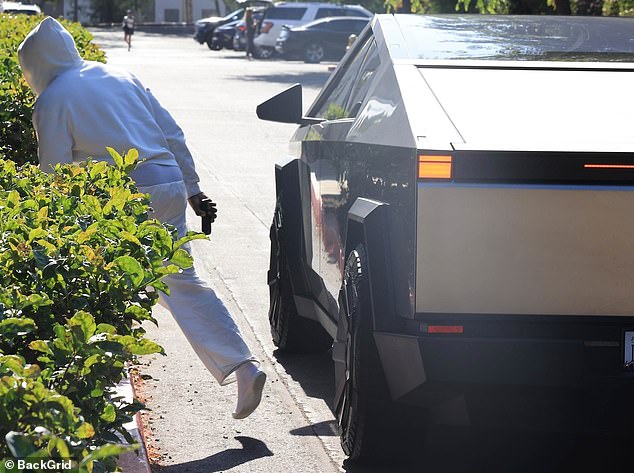 The rap star arrived at his son's basketball game in a shiny Tesla Cybertruck, pulled up to the hedges and slipped straight out of the car into the building.