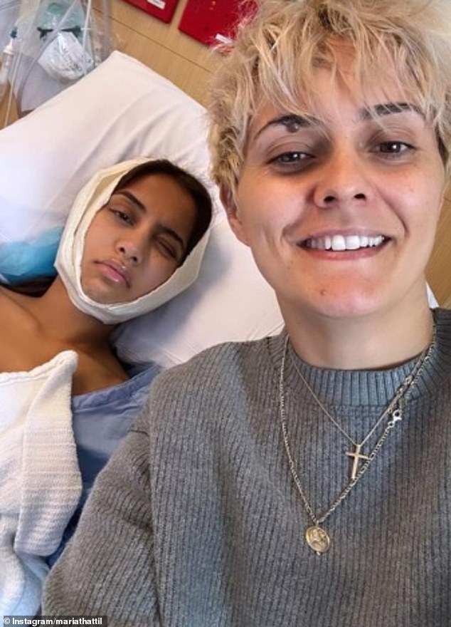 The stunner, 31, shared a photo of herself looking pained as she lay in a hospital bed and told fans she was still recovering after having her wisdom teeth removed.  Luckily, Maria's AFLW star friend Moana Hope (right) was able to cheer her up by visiting her in hospital