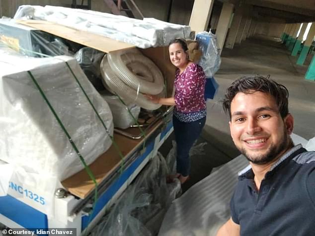 Cuban private entrepreneur Idián Chávez and his wife Ana unpack industrial equipment for their new toilet paper factory in Havana