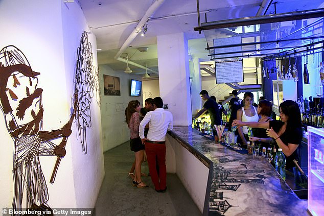 Customers meet at the bar and nightclub La Fabrica de Arte Cubano in Havana