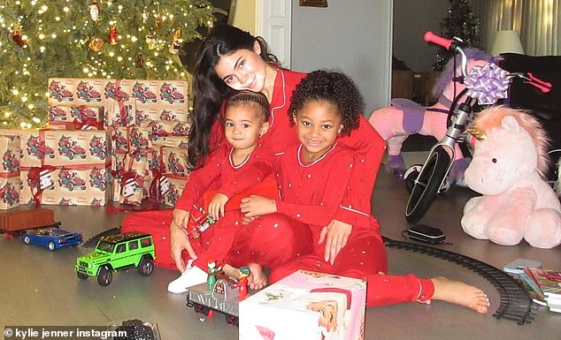 Kylie Jenner, 26, posted a heart alone alongside a series of photos of her and her two children Stormi, five, and Aire, two, who she shares with ex Travis Scott, 33