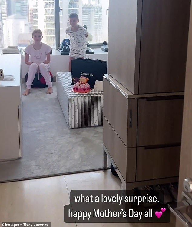 Earlier in the day, the publicist shared a video of her daughter Pixie, 12, (left) and son Hunter, 10, (right) presenting her with a special Mother's Day cake.