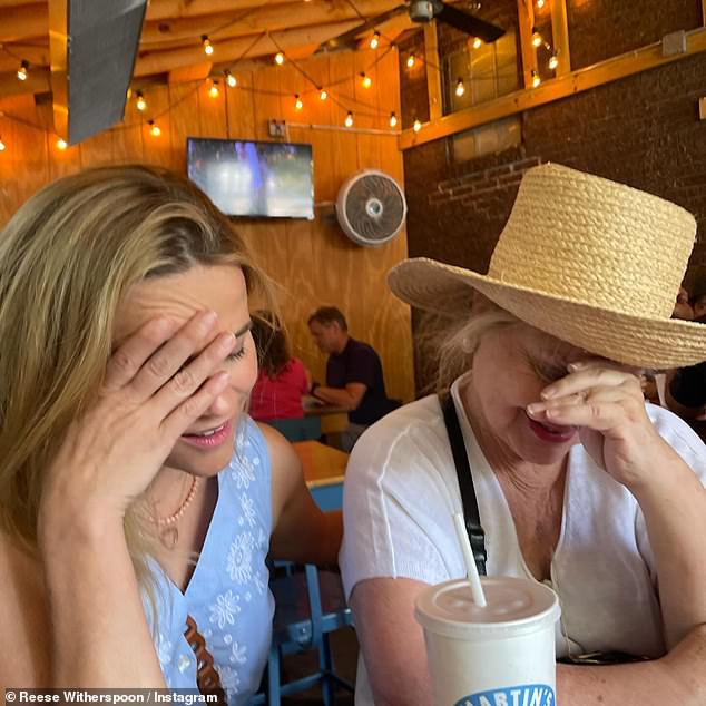 Among the mother-daughter photos are several showing Witherspoon and her look-alike mom having a good time.  A funny photo shows both Witherspoon and Reese pretending to be embarrassed