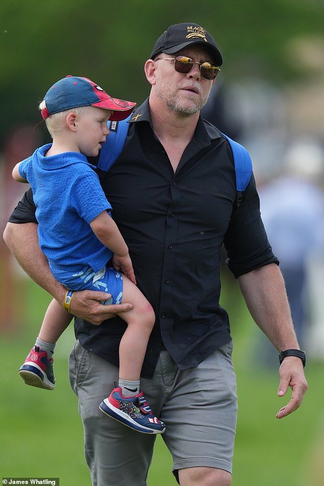 Lucas Tindall (left) with Zara's husband Mike Tindall (right) as they attend the event