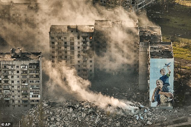 Putin understands that the West will give Ukraine just enough weapons to keep him at bay, but never enough to actually push his troops back across the border.  Pictured: Destroyed buildings in Bakhmut, Ukraine