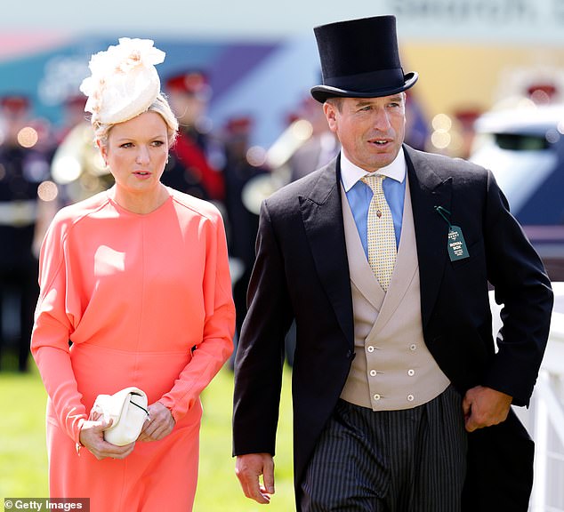 Peter started dating his long-time girlfriend Lindsay Wallace (pictured) following his split from Autumn Kelly, 45, in 2021. The pair are pictured together at Epsom in June 2022