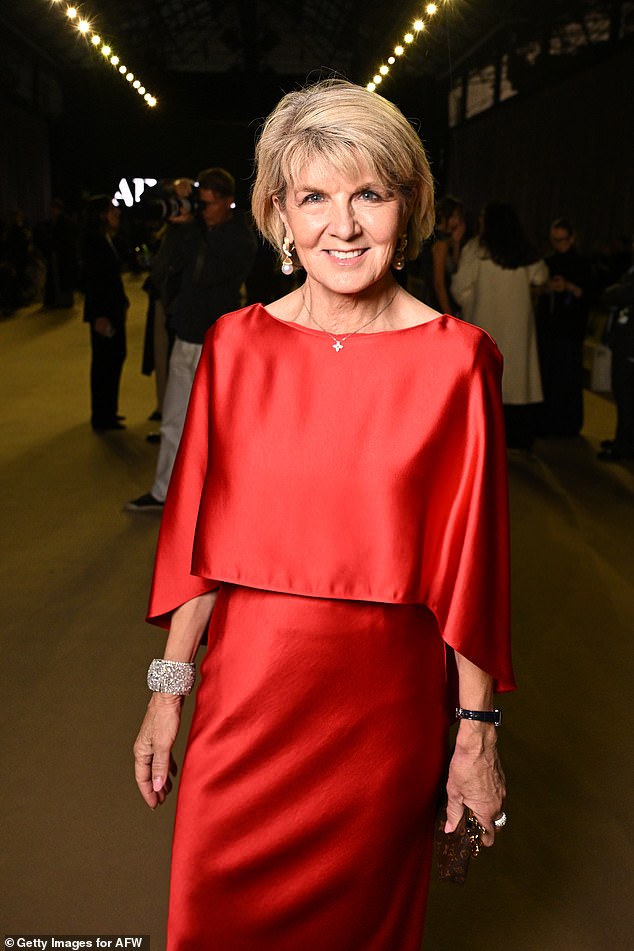 The former Foreign Secretary stunned in a flowing red satin maxi dress with an applied bodice.  She added a pair of statement earrings and a glittering diamond cuff