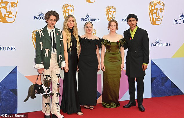 (left to right) Rollarson, Oxenham, Emma Moran, Máiréad Tyers and Hasna wearing Gaza ceasefire badges at the Baftas