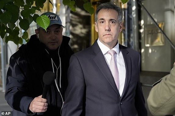 Michael Cohen leaves his apartment building on his way to Manhattan Criminal Court, Monday, May 13, 2024, in New York.  (AP Photo/Julia Nikhinson)