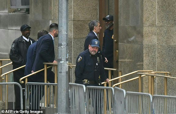 Former Trump lawyer Michael Cohen (C) arrives at Manhattan Criminal Court on May 13, 2024 for the trial of former US President Donald Trump for allegedly covering up hush money payments related to extramarital affairs in New York City.  (Photo by ANGELA WEISS/AFP) (Photo by ANGELA WEISS/AFP via Getty Images)