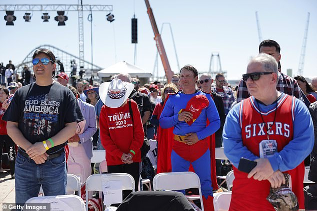 Supporters of former President Donald Trump listen to the national anthem before Saturday's rally in Wildwood, New Jersey.  Trump is in the process of choosing a ticket mate with supporters saying they liked Gov. Ron DeSantis, Sen. JD Vance, Vivek Ramaswamy and others