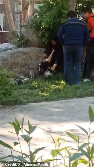 This is the shocking moment a suspected female morality police officer attacked a screaming teenager and pushed her to the ground