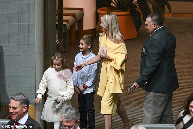 Laura Chalmers arrived at Parliament with two of her children, wearing an $899 yellow Carla Zampatti dress and a matching $999 jacket