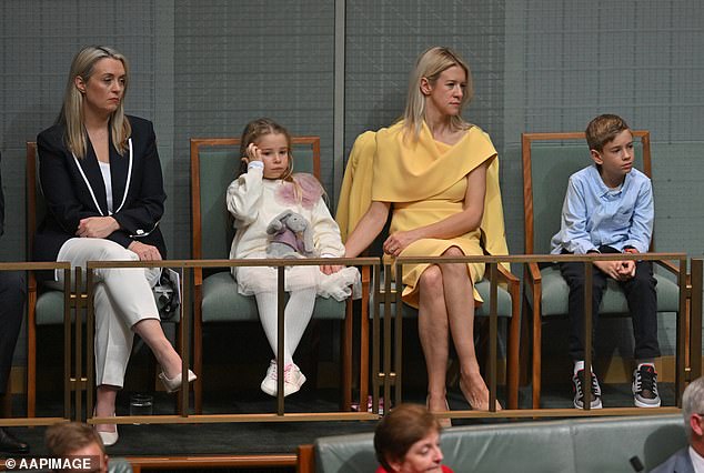 Ms Chalmers, wearing a yellow dress to match her blonde hair, sat with two of their children and Prime Minister Anthony Albanese's fiancée, Jodie Haydon (left), in Parliament