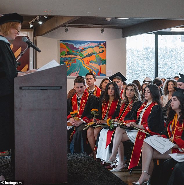 More than 50 students, dressed in black robes and red sashes, and nearly 200 guests gathered for the event at USC's Hillel Center campus as private security guards watched over the event