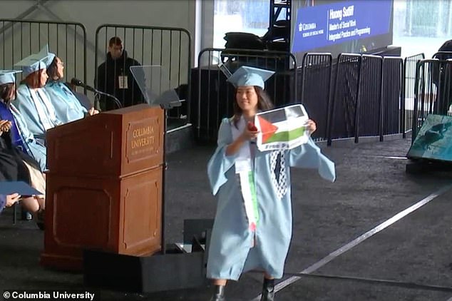 Graduating students put on handcuffs, displayed Palestinian flags and tore up diplomas during a graduation ceremony at embattled Columbia University