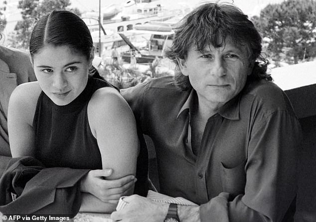 In this file photo taken on May 8, 1986, film director Roman Polanski (right) and British actress Charlotte Lewis (left) pose prior to the screening of the film 'Pirates' during the Cannes International Film Festival.  Lewis was 16 when she appeared in the film