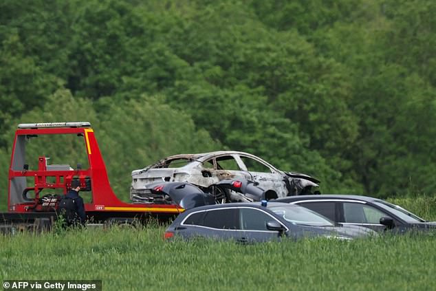 French authorities were seen towing away a burnt-out vehicle believed to have been used in the prisoner's escape