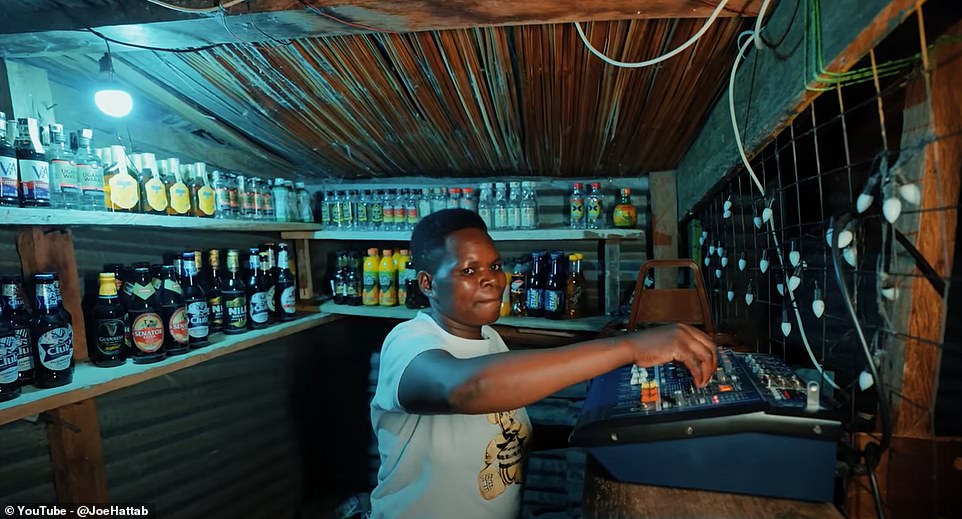 In a small supermarket, where alcohol and soft drinks are for sale, he finds the salesman playing music and using a makeshift DJ deck.