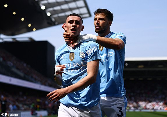 Football - Premier League - Fulham v Manchester City - Craven Cottage, London, Great Britain - May 11, 2024 Manchester City's Phil Foden celebrates his second goal with Ruben Dias REUTERS/David Klein FOR EDITORIAL USE ONLY.  NO USE WITH UNAUTHORIZED AUDIO, VIDEO, DATA, BANDLE LISTS, CLUB/LEAGUE LOGOS OR 