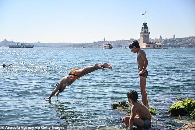 The Earth warmed during its hottest summer on record, as record heat in August capped a brutal, deadly three months in the Northern Hemisphere.  In the photo, people in Istanbul jump into the sea to keep cool, August 22, 2023