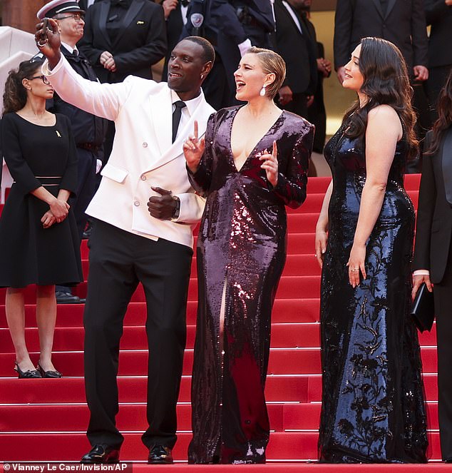 Killers of the Flower Moon actress Lily, 37, gave a heart to the adoring crowd at the screening of The Second Act, while Greta, 40, (seen centre) did a peace sign as she posed for a selfie