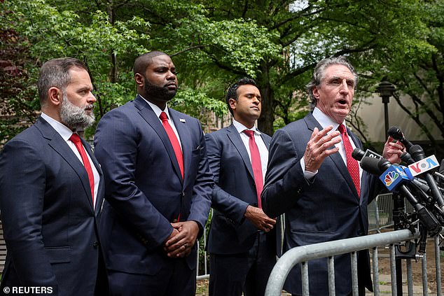 North Dakota Governor and former US presidential candidate Doug Burgum speaks during a press conference with businessman Vivek Ramaswamy, US Representative (R-FL) Cory Mills and US Representative Byron Donalds (R-FL), after attending the trial