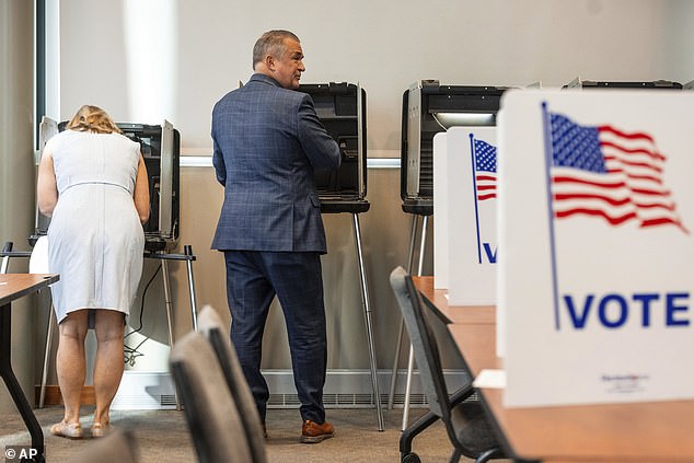 Representative Don Bacon and his wife Angie Bacon vote during the Nebraska primaries