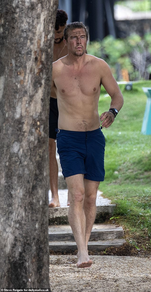 Topless Grylls, 49, wearing navy blue swim shorts, appeared with a friend on the beach in Guanacaste province