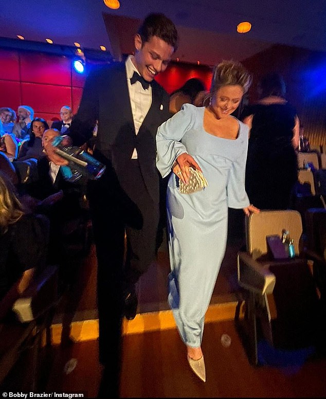 Bobby was pictured helping pregnant TV star Emily Atack during the ceremony and escorting her down the stairs to ensure her safety