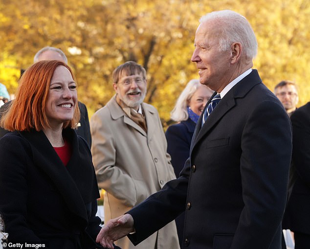 US President Joe Biden greets White House Press Secretary Jen Psaki