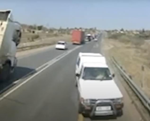 The truck crashes into the car as it tries to get out of the way on the N2 in South Africa