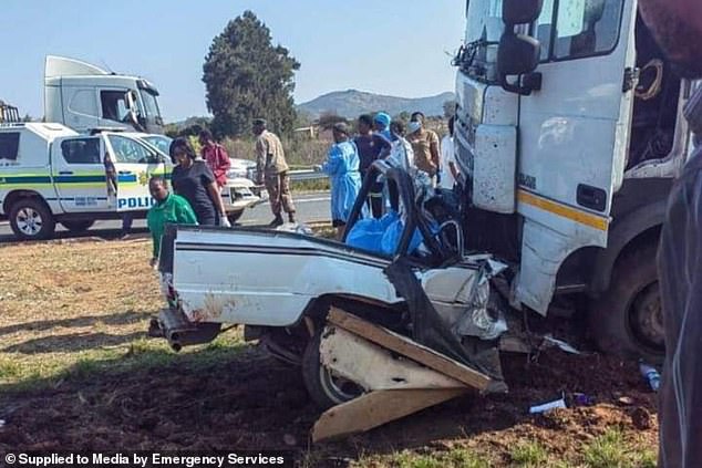 Gruesome photos of the aftermath show the Toyota car completely crushed by the truck