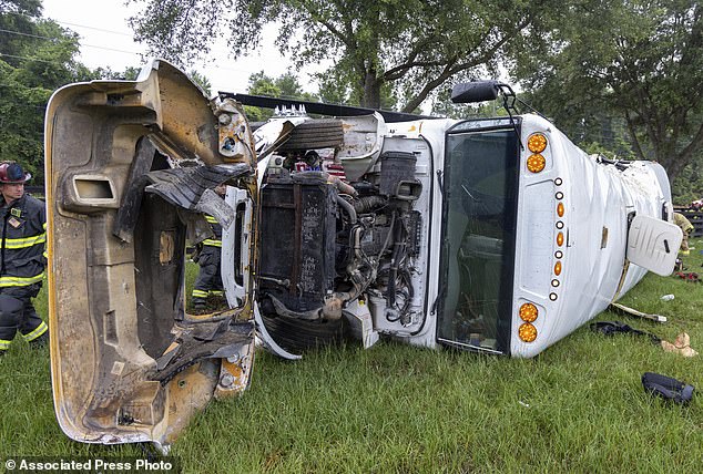 Howard also said he took two anti-seizure medications and high blood pressure medications Monday night, in addition to smoking marijuana oil.  (photo: the bus is turned over on the grass after the crash)