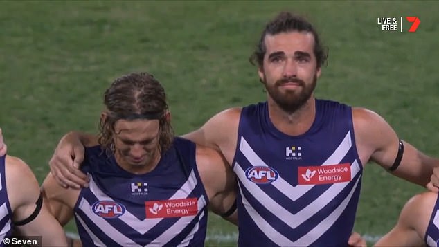 Fremantle players including Nat Fyfe (left) and Alex Pearce (right) struggled to hold back tears as they paid tribute to their partner the day after his death