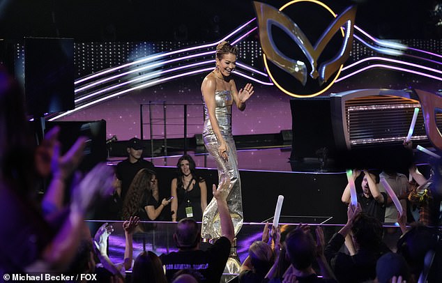 Rita looked beautiful in a gold dress