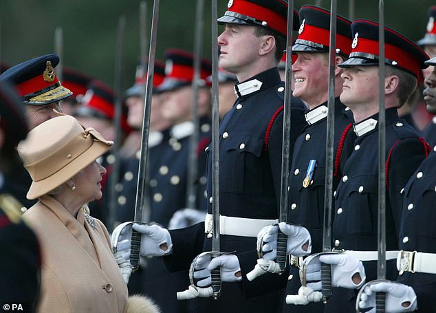 Prince Harry fails to keep a straight face as his grandmother, Queen Elizabeth, judges him and his fellow officers during The Sovereign's Parade at the Royal Military Academy in Sandhurst