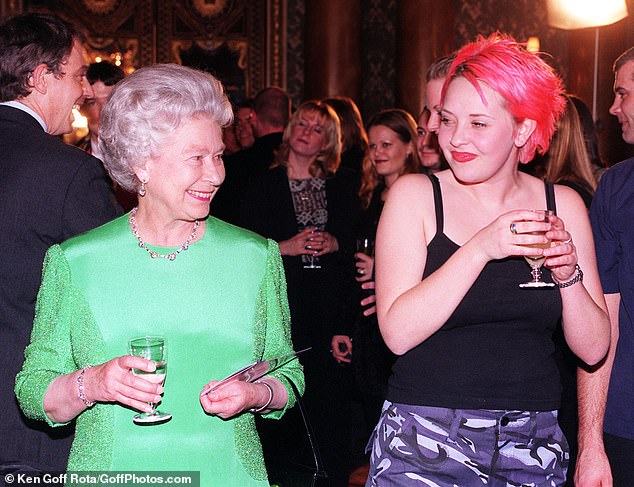 The Queen smiles warmly at Liverpool Institute of Performing Arts student Julie Thompson (right) after her performance at Buckingham Palace, 1998