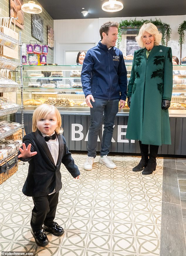 23-month-old Fitzwilliam Corrie-Salmon steals the spotlight from Queen Camilla during a visit to a bakery in Northern Ireland in March this year