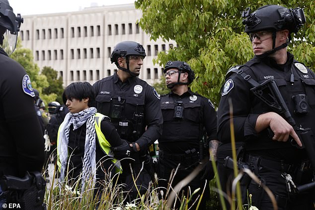 According to CNN, 12 protesters were arrested, many of whom were zip-tied and taken away